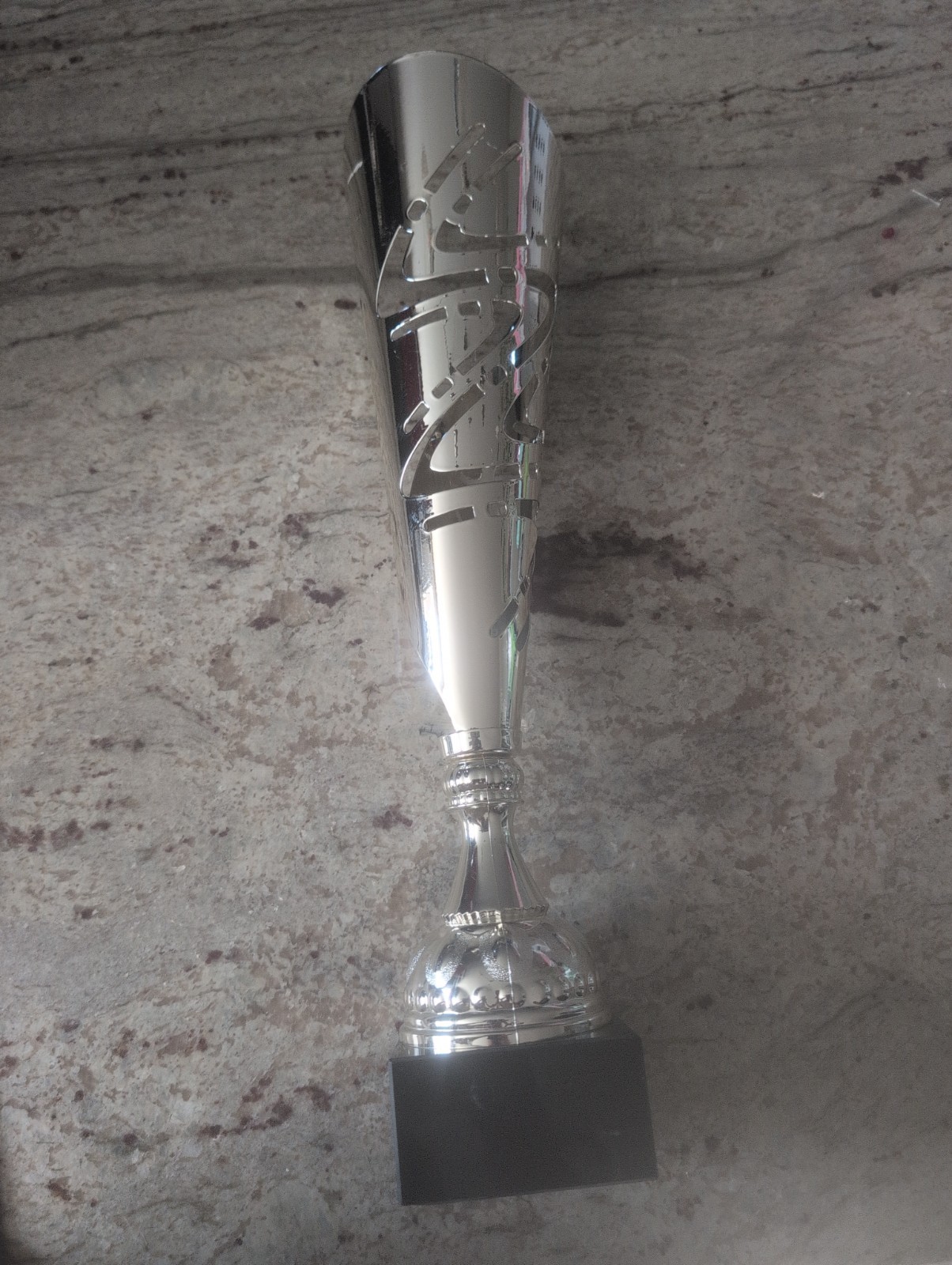 Silver-plated modern metal trophy featuring laser-cut geometric pattern