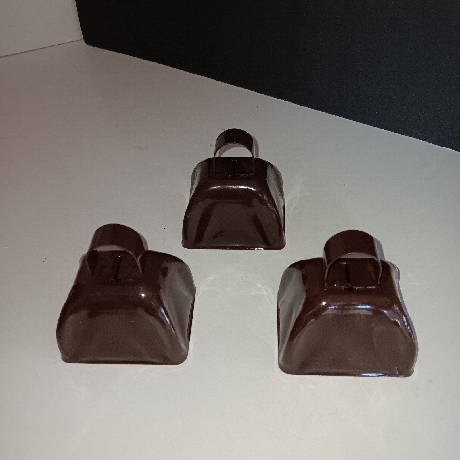 Metal Cowbells, Set Of Three, Metal On Metal Sound. Painted Brown. Decorative Or