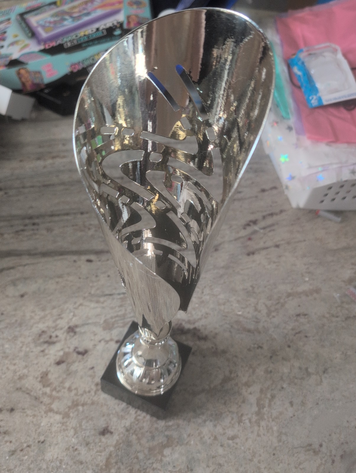Silver-plated modern metal trophy featuring laser-cut geometric pattern