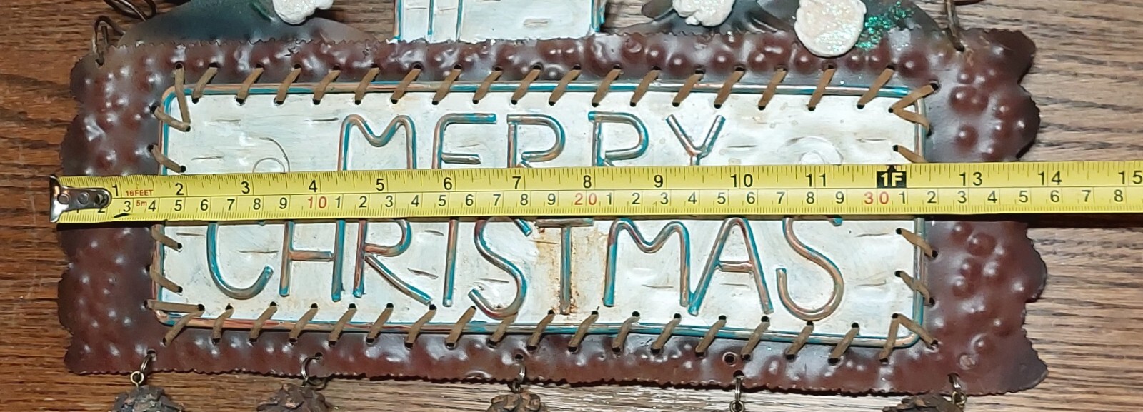 Winter rustic cabin forest scene “Merry Xmas” wall hanging w/dangling pine cones