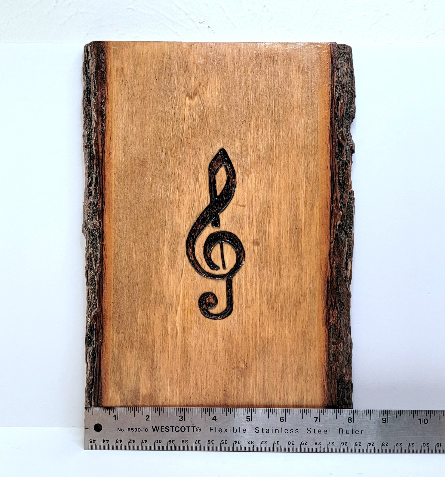Handmade Wood slice wall art with engraved Treble or G Clef music note.