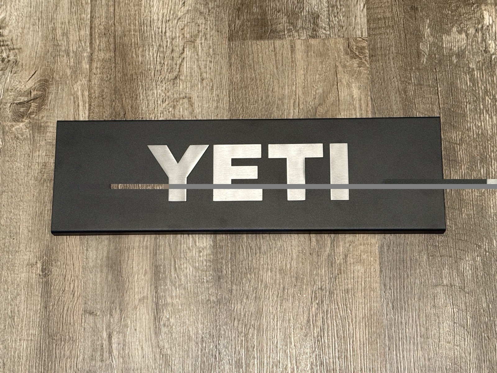 YETI Coolers Metal Advertising Dealer Display Sign 20” x 6” Black Silver